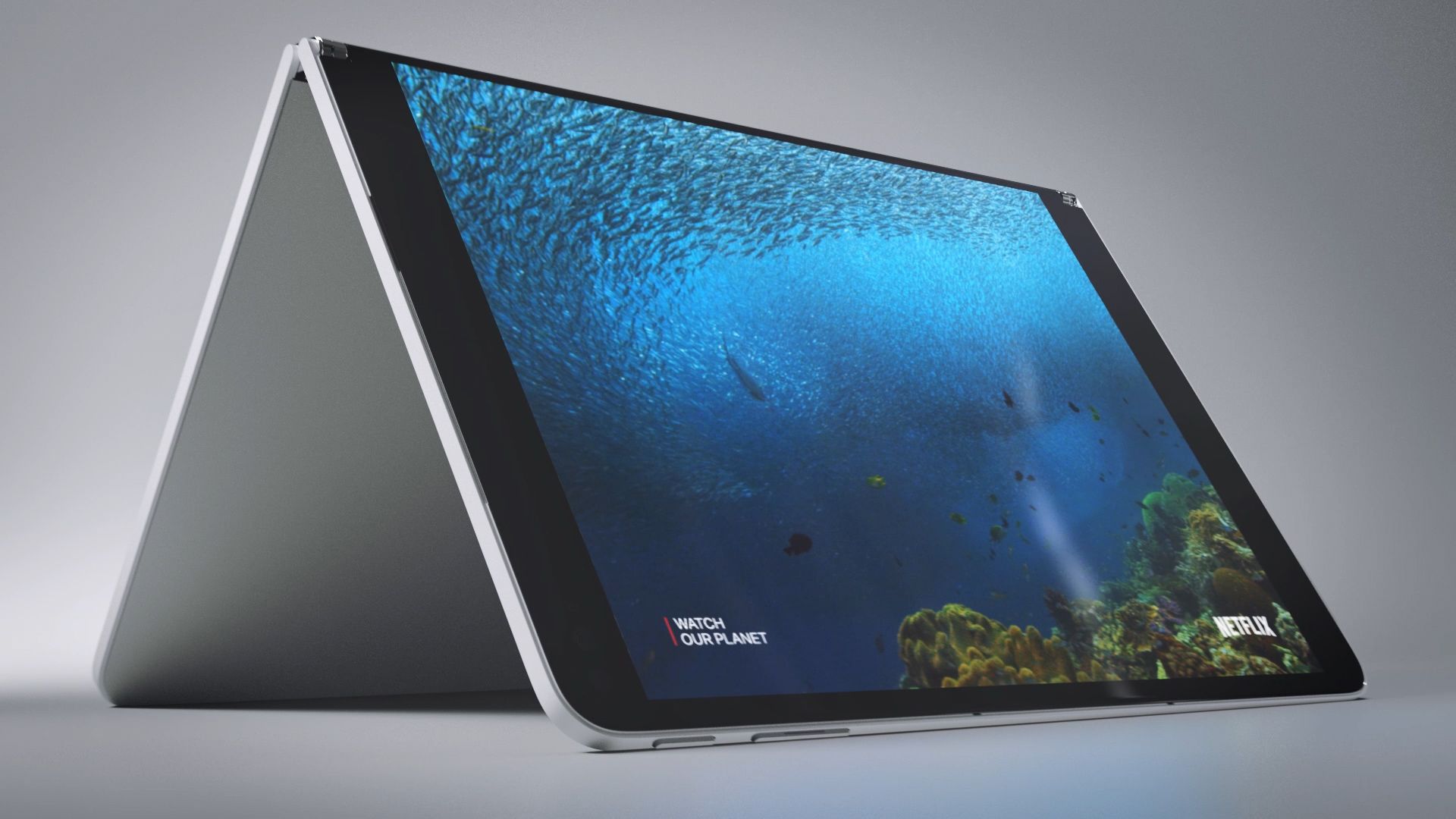 Surface Neo står åben på en overflade og viser en film på en af skærmene