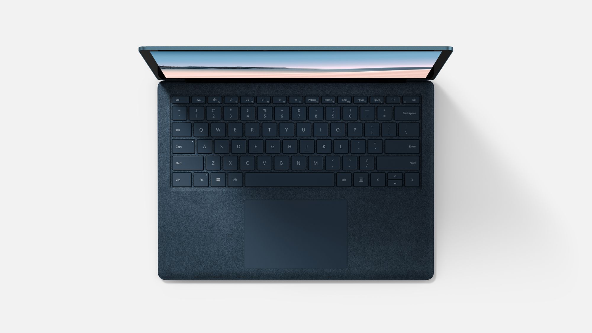 Der Surface Laptop in Kobaltblau aufgeklappt aus der Vogelperspektive 