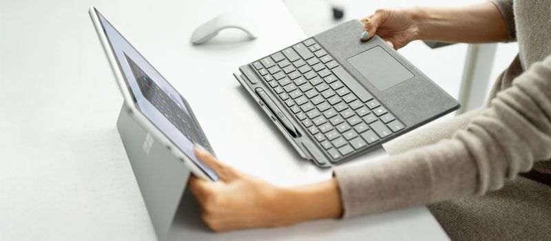 Surface Pro 9 with detachable Surface Pro Signature Type Cover and an Arc Mouse